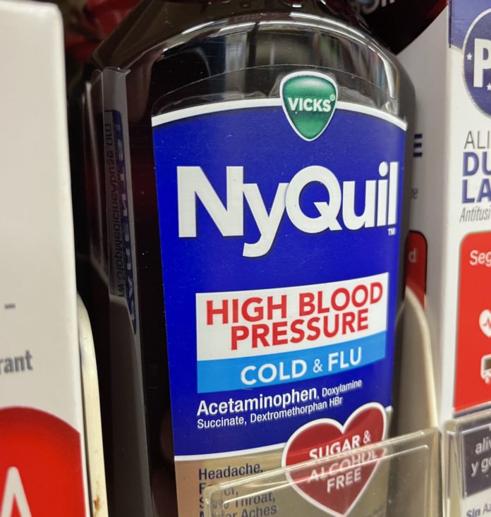 Grocery store medicine section Nyquil cough syrup