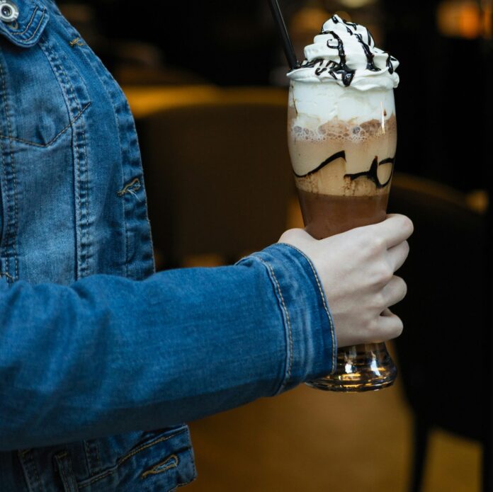 Woman holding a cold chocolate milky cocktail