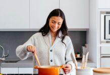 The Hidden Secret to Cooking Like a Pro Chef Woman stirring a pot in a kitchen