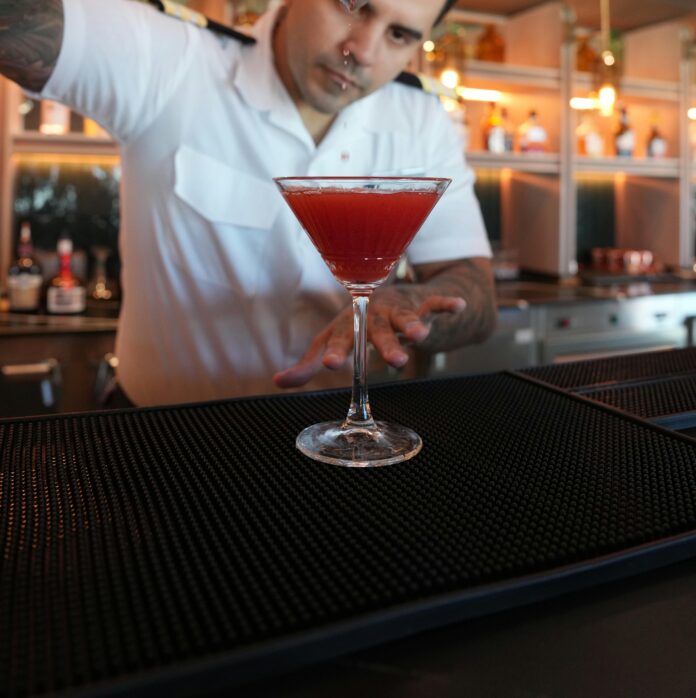 Bartender pouring a martini